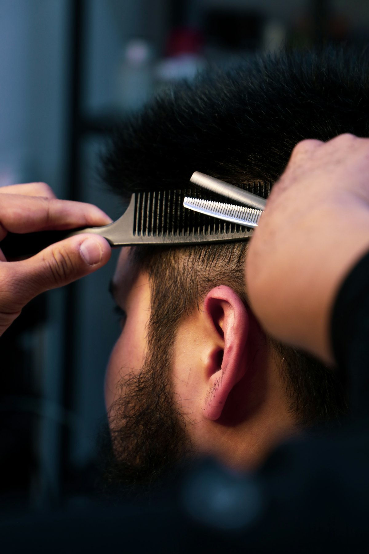 Barber using thinning shears
